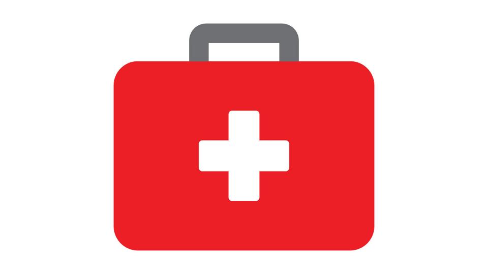 Illustration eines roten Koffers mit einem weißen Kreuz in der Mitte